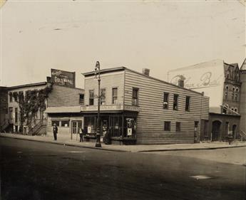 (GRISTEDE BROS. GROCERY--NEW YORK ) A binder with approximately 85 photographs arranged chronologically documenting the history and evo